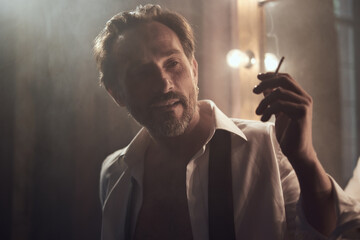 cinematic photo shoot of the confident actor celebrity look in foggy loft room