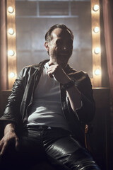 cinematic photo shoot of the confident actor celebrity look in foggy loft room