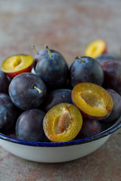 Plums in vintage bowl