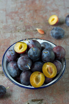 Plums in vintage bowl