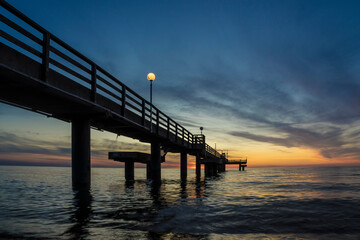 Fototapeta na wymiar Pier on the baltic sea at sunset.