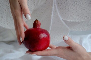 red garnet in the tender hands of an unknown girl