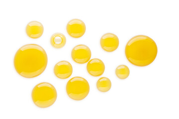 Macro honey drops isolated on white background with clipping path.