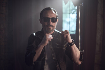 cinematic photo shoot of the confident actor celebrity look in foggy loft room