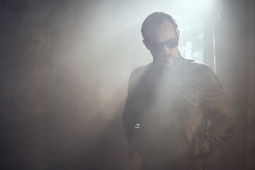 cinematic photo shoot of the confident actor celebrity look in foggy loft room