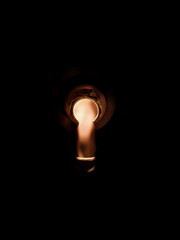 Keyhole on a dark background, yellow low light