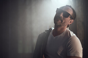 cinematic photo shoot of the confident actor celebrity look in foggy loft room