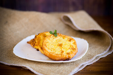 round bread croutons fried in batter in a plate