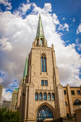 Fototapeta premium Cityscape of Tulsa Oklahoma USA with gothic chruch with copper spires in foreground