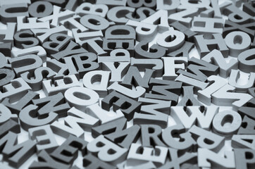 Abstract black and white background of wooden letters of the Latin alphabet. Concept: back to...
