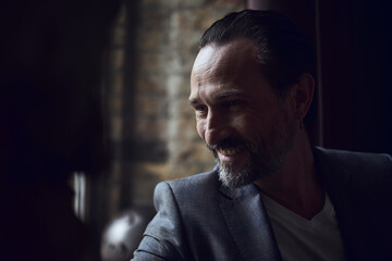 cinematic photo shoot of the confident actor celebrity look in foggy loft room