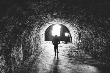 Silhouetted figure in the dungeon of Dunnottar Castle, Scotland