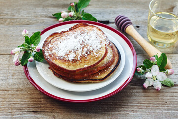 Pancakes with honey for breakfast.