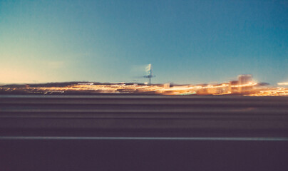 Motion picture taken from the window of a car on the highway.