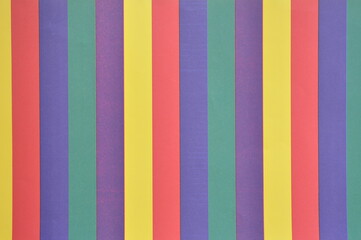 Texture with various background colors vertically on cardboard
