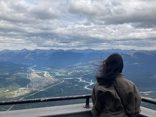 Girl with flowing hair and beautiful landscape
