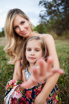 Portrait of a mother carrying her daughter