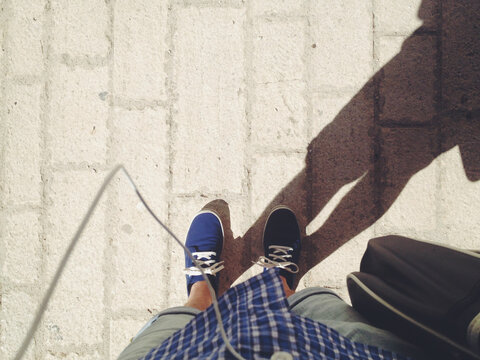 Blue Sneakers on Ground