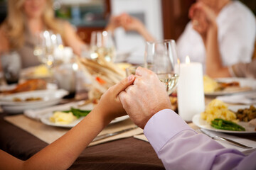 Thanksgiving: Family Saying a Blessing Before Dinner