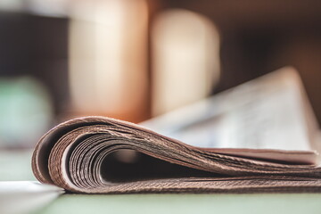 Folded newspapers on a table