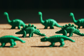 Closeup Image of Green Toy Dinosaurs Lined Up