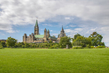 Fototapeta na wymiar Long sweeping view across lawn at Major's Hill Park with the Parliament Hill in the mid-ground with Peace Tower and Library of Parliament nobody
