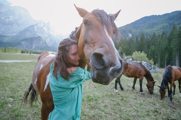 Woman with her horse enjoying outdoors