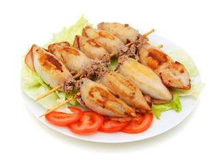 Cuttlefishes wihte meat in dish on white background