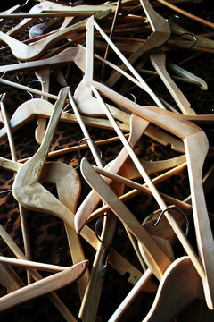 Pile Of Wooden Clothes Hangers