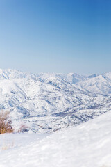 Obraz premium The mountain resort of Beldersay, Uzbekistan. Panorama of the mountains from the pass in winter