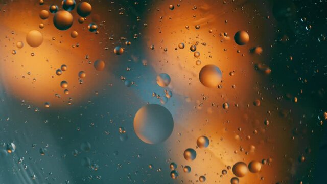 Oil drop floating on the water. Abstract bubble background.