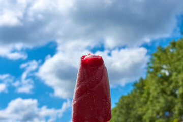 Ice cream popsicle with strawberry flavor, with place for text