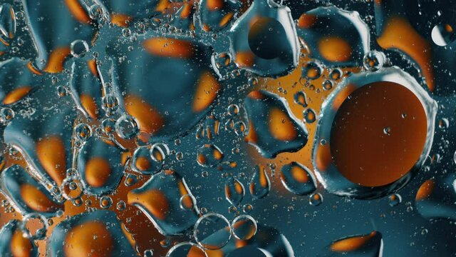 Melting Plastic Bubbles. Iridescent plastic surface melting, warping, and boiling.