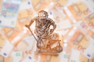 Lady Justice is on several 50 and 20 Euro bills. Concept photo for a lawsuit where a lot of money...