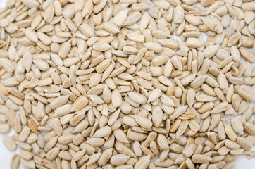 Peeled sunflower seeds background. Sunflower seeds texture