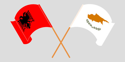 Crossed and waving flags of Albania and Cyprus