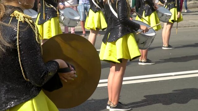 Young girls drummer at the parade. Street performance