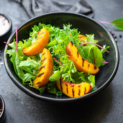 salad grilled peach lettuce leaves mix raw nectarine ingredient serving size top view copy space for text 