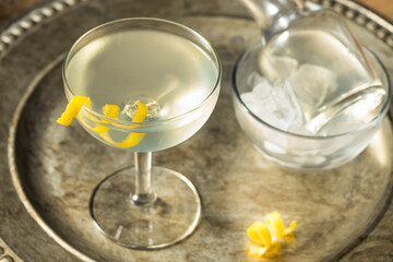 Fototapeta na wymiar Refreshing Dry Martini with a Lemon Garnish