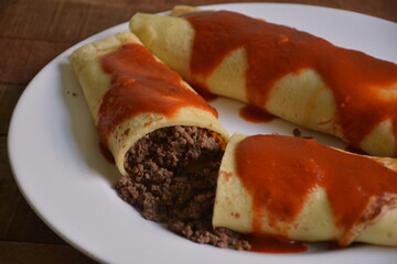 
meat pancake with tomato sauce