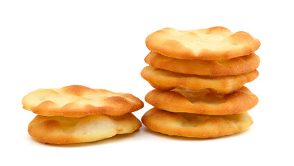 A stack of cheesy rice crackers on a white background.