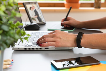  Beautiful graphic designer drawing digital design on a drawing tablet