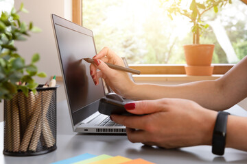  Beautiful graphic designer drawing digital design on a drawing tablet