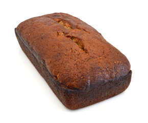 A fresh homemade loaf of banana walnut bread on white background