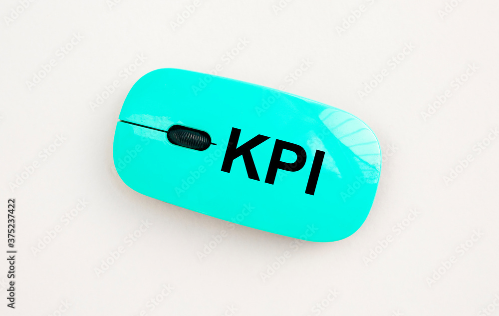 Poster kpi key performance indicator written on computer mouse. business kpi