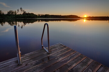 Obraz na płótnie Canvas Evening bath time in Swedish lake