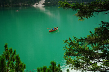 Couple on boat on Lago di Braies on a summer day, Dolomites, Unesco, Trentino Alto Adige, Sudtirol,...