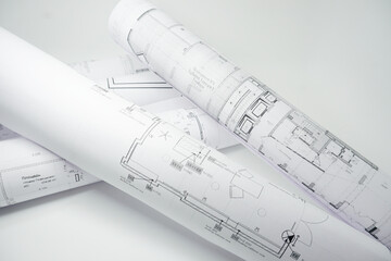 Architectural projects plans rolls paperwork home sketch.