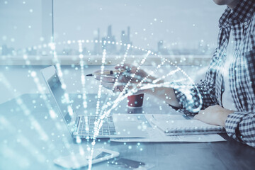 DNA hologram with businessman working on computer on background. Concept of bioengineering. Double...