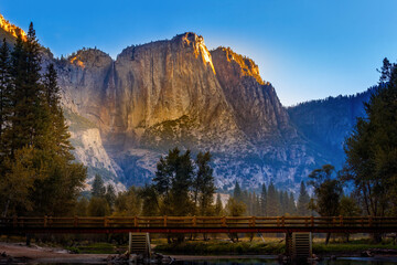 El Capitan lit by the first sun-rays in the morning short after sunrise, Yosemite National Park, California USA